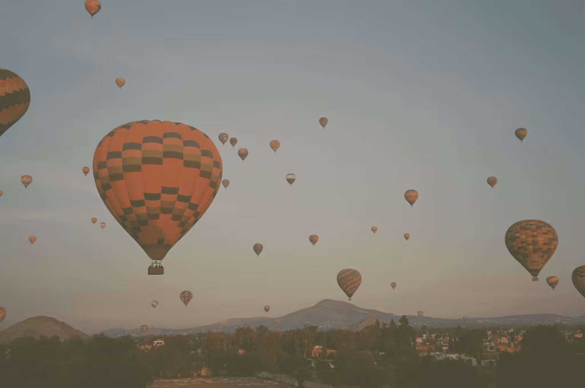 Hot air balloons over the ancient ruins at Teotihuacan