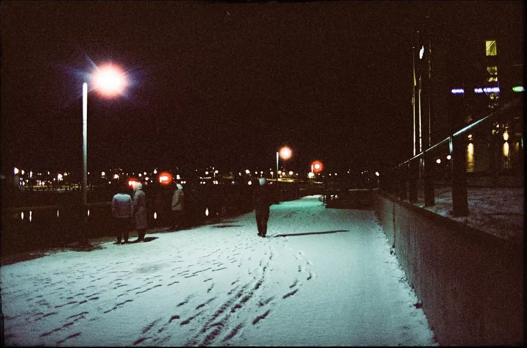 Snowy waterfront path at night under streetlights, CineStill 800T, Canon AE-1, by @cokm.photo