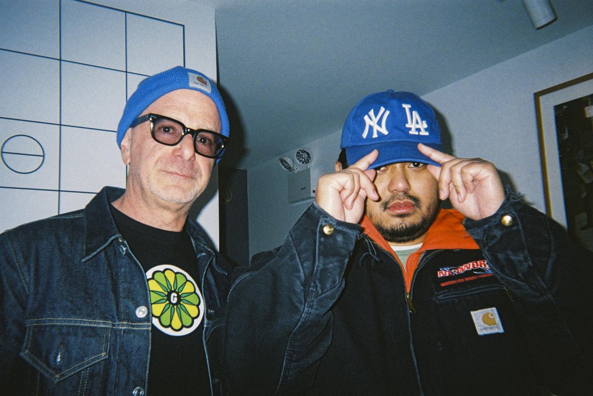 Two friends posing for a flash photo, shot on a Gelatin disposable camera